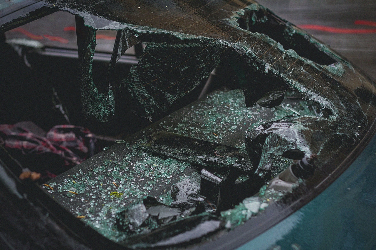 Car with smashed rear window representing a motor vehicle accident