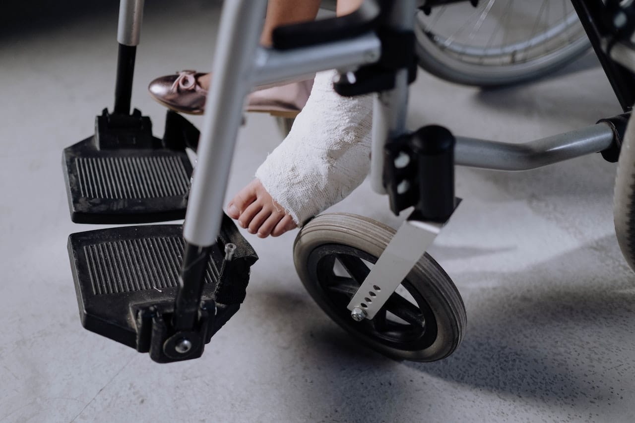 injured girl sitting in a wheelchair
