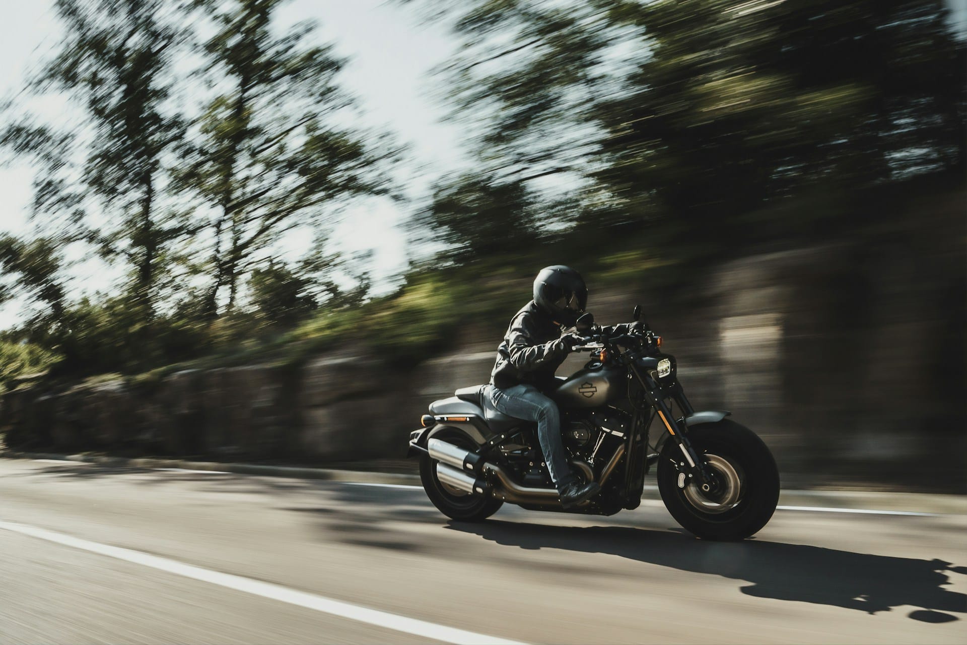 person riding a black motorcycle