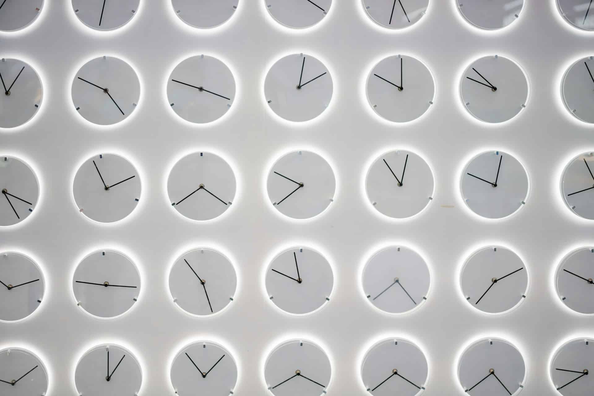 a wall of clocks at different times