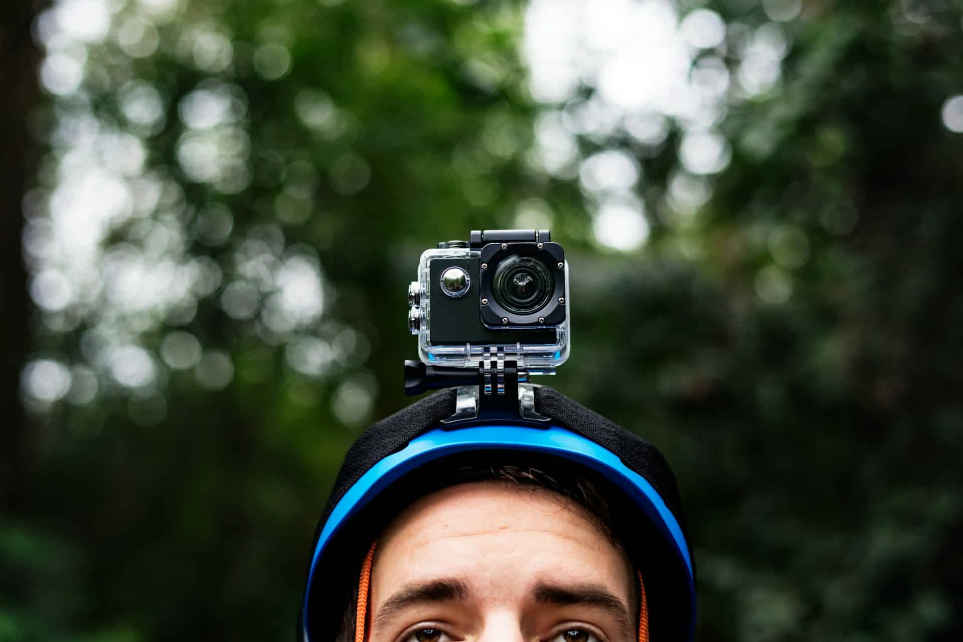 Close-up of the top of a man’s head, wearing a helmet with a small video camera attached to the top, representing helmet cams and motorcycle accident injury claims in Alberta