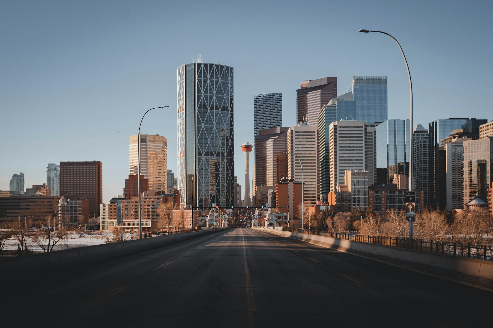 A city street leading into the Calgary skyline, representing Canadian Lawyer top personal injury boutique law firms.