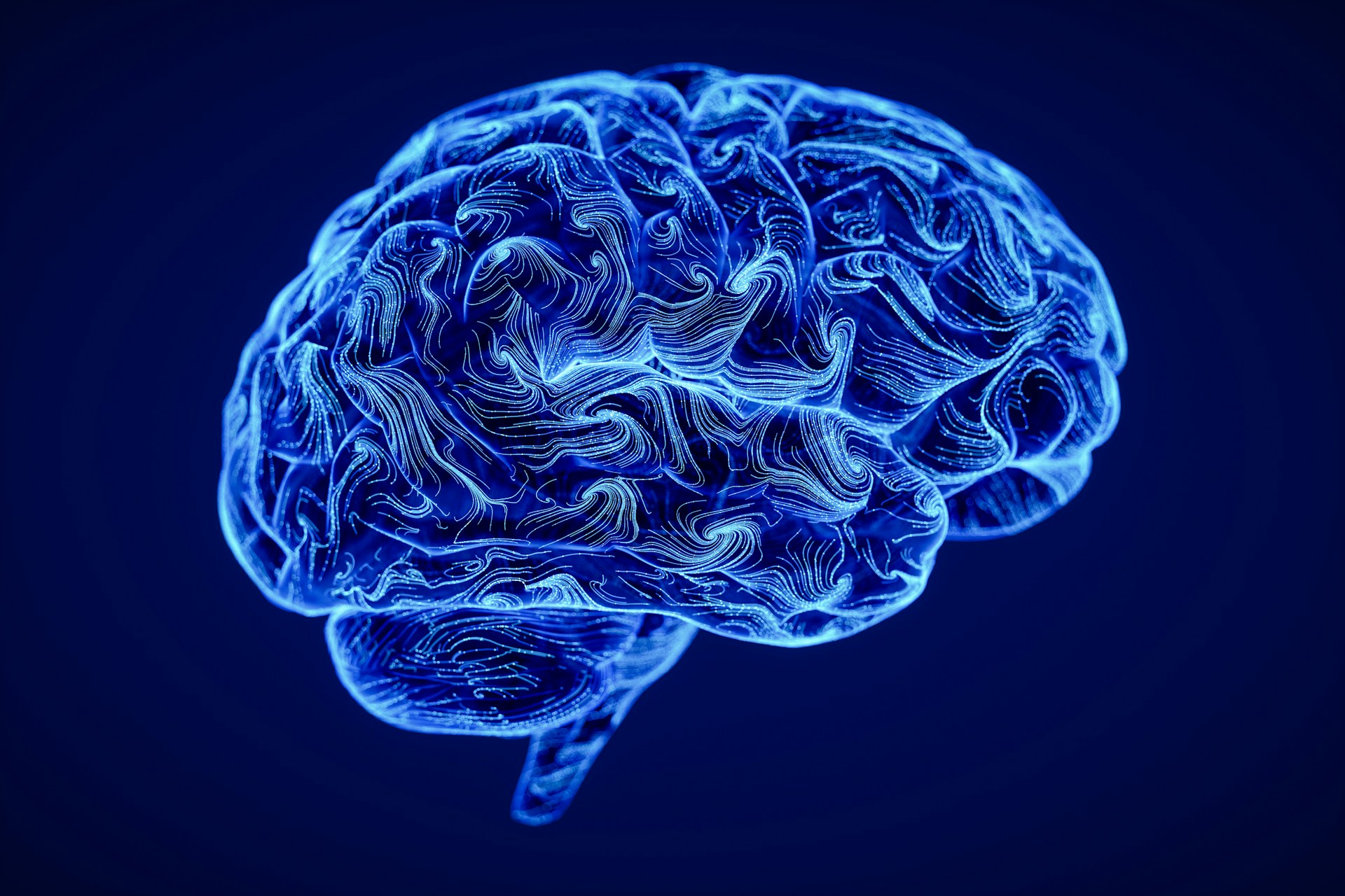 A blue 3-D brain made up of digital swirls, representing brain injury in Alberta.
